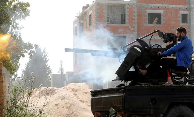 A member of the Libyan internationally recognised government forces fires during a fight with Eastern forces in Ain Zara, Tripoli, Libya April 25, 2019. REUTERS/Hani Amara