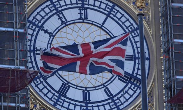 FILE PHOTO: A face of the Big Ben clock tower is seen a day before New Year celebrations, during which the bells of Big Ben will chime at midnight, despite otherwise being silent for the duration of the restoration works currently being undertaken at The 