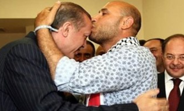 Mahdy al-Haraty kisses Erdogan's head - FILE