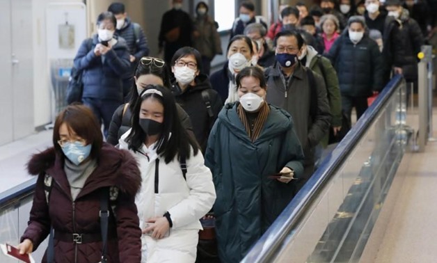 Passengers arriving from the Chinese city of Wuhan arrive at Narita Airport in Chiba, Japan in this photo taken by Kyodo January 23, 2020. Mandatory credit Kyodo/via REUTERS
