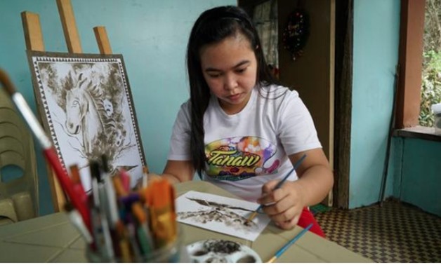 Ash from a rumbling Philippine volcano has inspired an artist and instructor to paint watercolors using the gray powder that had covered the plants in her backyard./Reuters