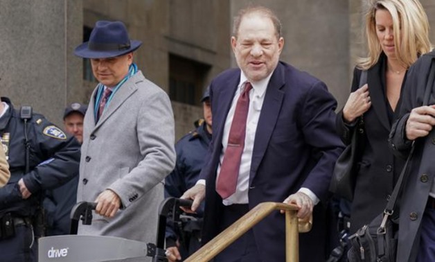 FILE PHOTO: Film producer Harvey Weinstein and his legal team leave the Criminal Court during his sexual assault trial in the Manhattan borough of New York City, U.S., January 28, 2020. REUTERS/Bryan R Smith