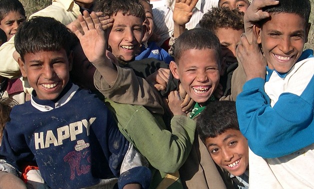 Children jostle playfully for the best spot in front of the camera- CC via Flickr/Mohammed Shamma