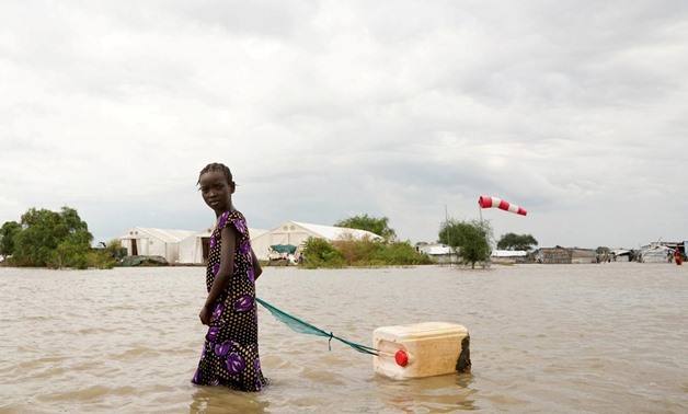 FILE PHOTO: A girl walks in water after heavy rains and floods forced hundreds of thousands of people to leave their homes, in the town of Pibor, Boma state, South Sudan, November 6, 2019.Picture taken November 6, 2019. REUTERS/Andreea Campeanu/File Photo