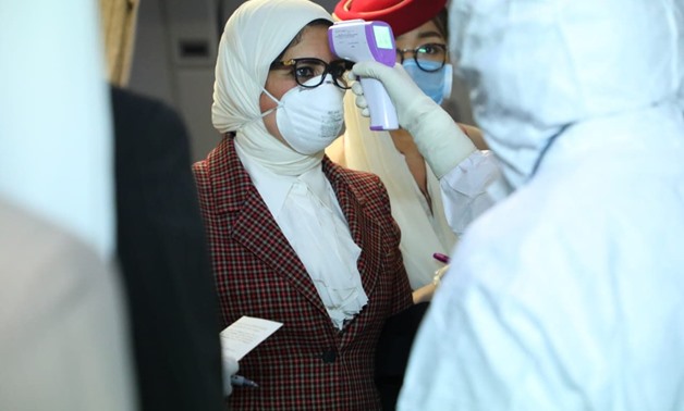 FILE- Minister of Health Hala Zayed and her accompanying delegation underwent examination and preventive measures immediately upon her arrival at Beijing airport Monday - Press photo 