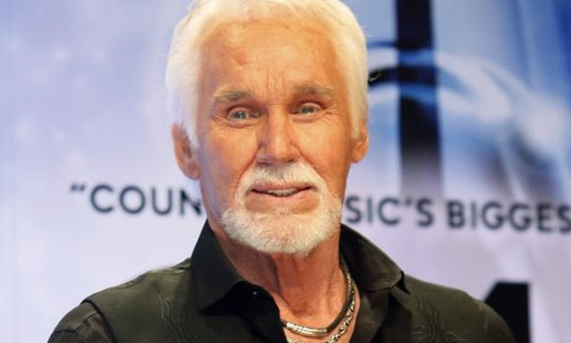 FILE PHOTO: Kenny Rogers poses backstage after accepting the Willie Nelson Lifetime Achievement award at the 47th Country Music Association Awards in Nashville, Tennessee November 6, 2013. REUTERS/Eric Henderson.