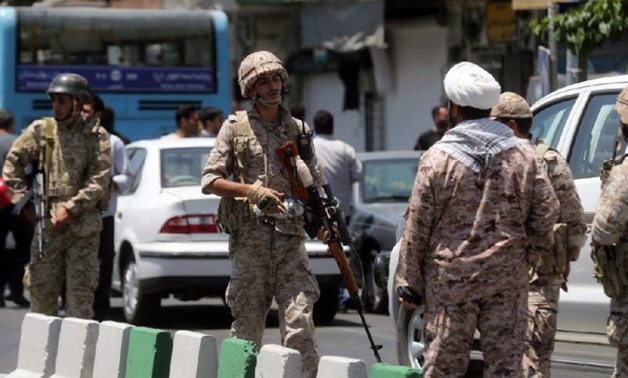 Iran's Revolutionary Guard secure the area outside the parliament complex - AFP/Hossein MERSADI