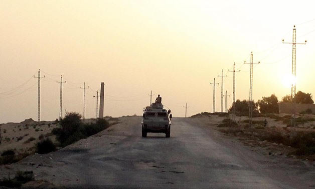 An Egyptian military vehicle is seen on the highway in northern Sinai, Egypt, in this May 25, 2015 file photo. REUTERS/Asmaa Waguih/Files