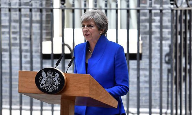 British Prime Minister and leader of the Conservative Party Theresa May delivers a statement outside 10 Downing Street after her audience with the Queen on Jun 9, 2017 - AFP/Ben Stansall
