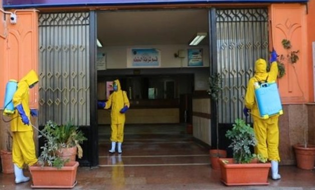 FILE – A part of a disinfection campaign inside Al-Muqattam prison