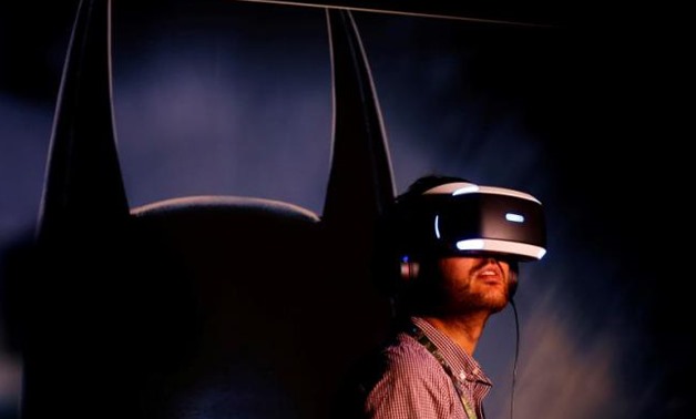 People try the new Sony VR headset during Sony Corporation's PlayStation 4 E3 2016 event - REUTERS