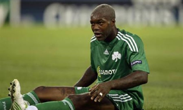 Panathinaikos' Djibril Cisse sits on the pitch during their Champions League soccer match against Atletico Madrid at Vicente Calderon stadium in Madrid in this August 25, 2009 file photo. REUTERS/Sergio Perez/Files
