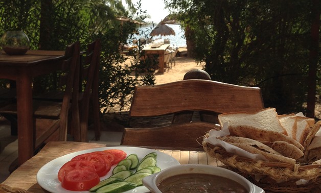 Vegan meal with a sea view served at the beach restaurant in Sinai - Monika Sleszynska