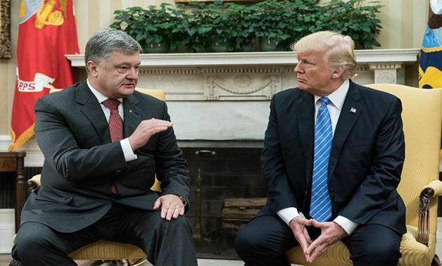 US President Donald Trump meets with his Ukrainian counterpart Petro Poroshenko in the Oval Office at the White House in Washington, DC, on June 20 - AFP 
