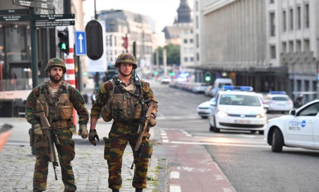 Belgian Army soldiers patrol outside Central Station after a reported explosion in Brussels on Tuesday, June 20, 2017. Belgian media are reporting that explosion-like noises have been heard at a Brussels train station, prompting the evacuation of a main s