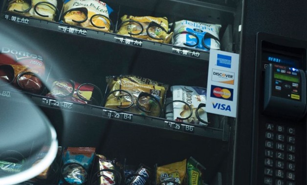 A report released this week shows the premier US intelligence body discovered that insider hackers had stolen more than $3,300 worth of potato chips, chocolate bars and other snacks from its vending machines. (AFP Photo/Eva Claire HAMBACH)