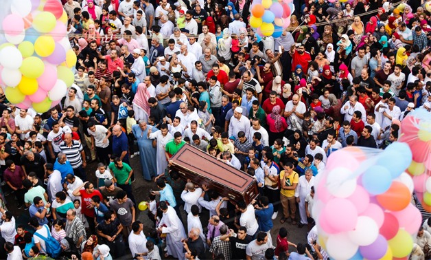 Funeral among Eid el Fetr celebrations in Cairo - Hazem Abdel Samad 